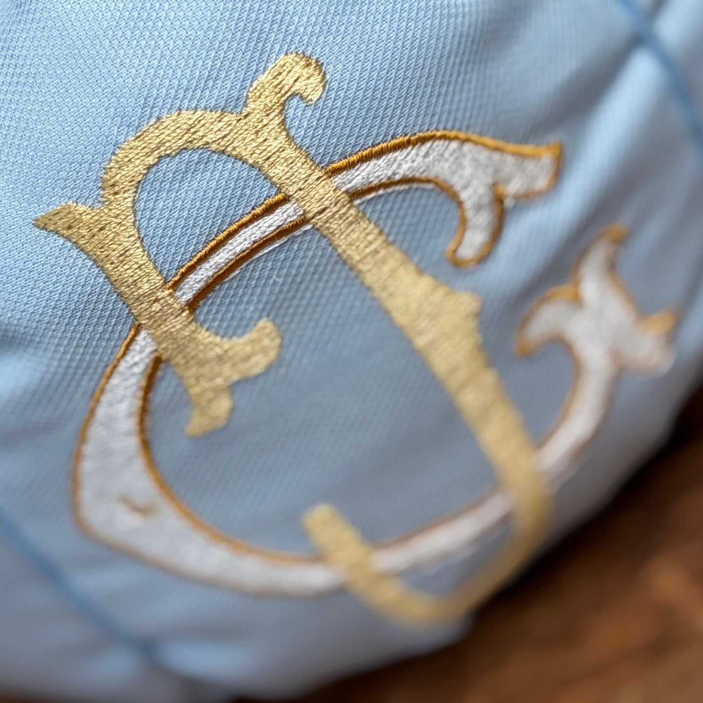 Close-up of layered gold embroidery on the personalized blue pumpkin