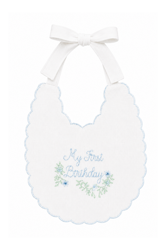 Blue Southern Floral linen first birthday bib with soft blue floral embroidery