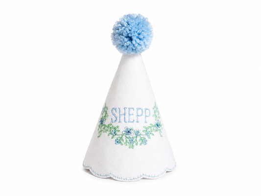 Blue Southern Floral personalized linen first birthday party hat with blue floral embroidery and blue pom pom