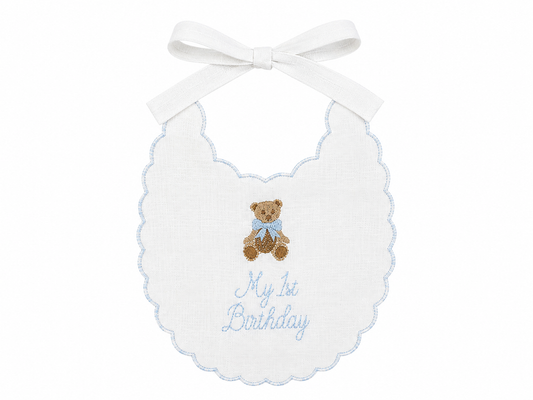 Blue Teddy Bear linen first birthday bib with embroidered teddy bear and blue details