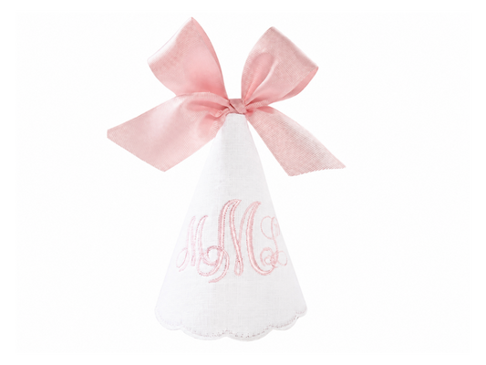 Blush monogrammed linen first birthday party hat with soft blush embroidery and pink bow topper