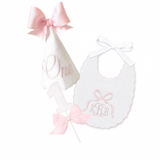 Blush One 3-piece first birthday cake smash set with blush party hat, ONE high chair banner, and bow cake topper