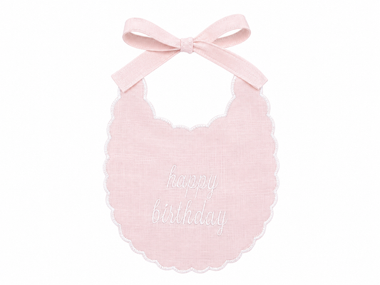 Classic Pink linen first birthday bib with Happy Birthday embroidery and scalloped edge