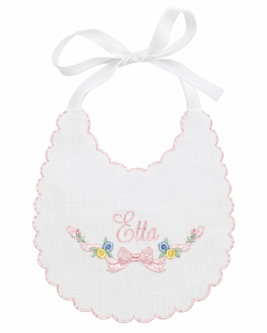 Etta Floral linen first birthday bib with pastel floral embroidery and scalloped edge