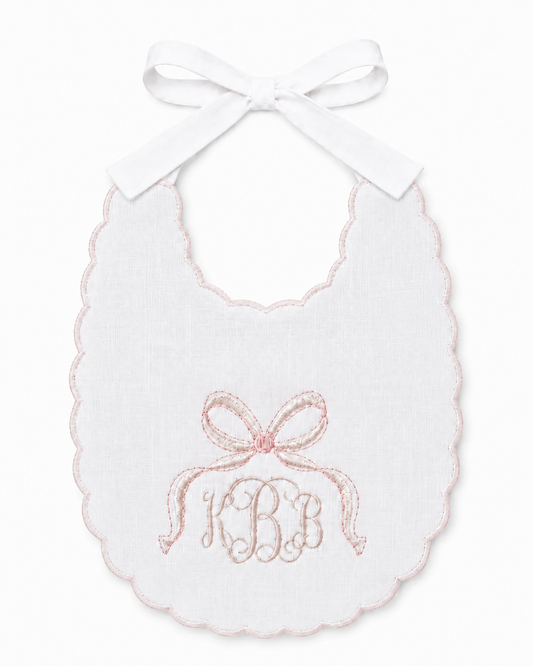 Heirloom Bow personalized linen first birthday bib with embroidered bow and name