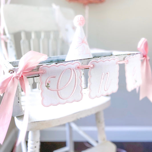 Rosebud First Birthday Hat and High Chair Banner Set – Linen Keepsake Party Decor