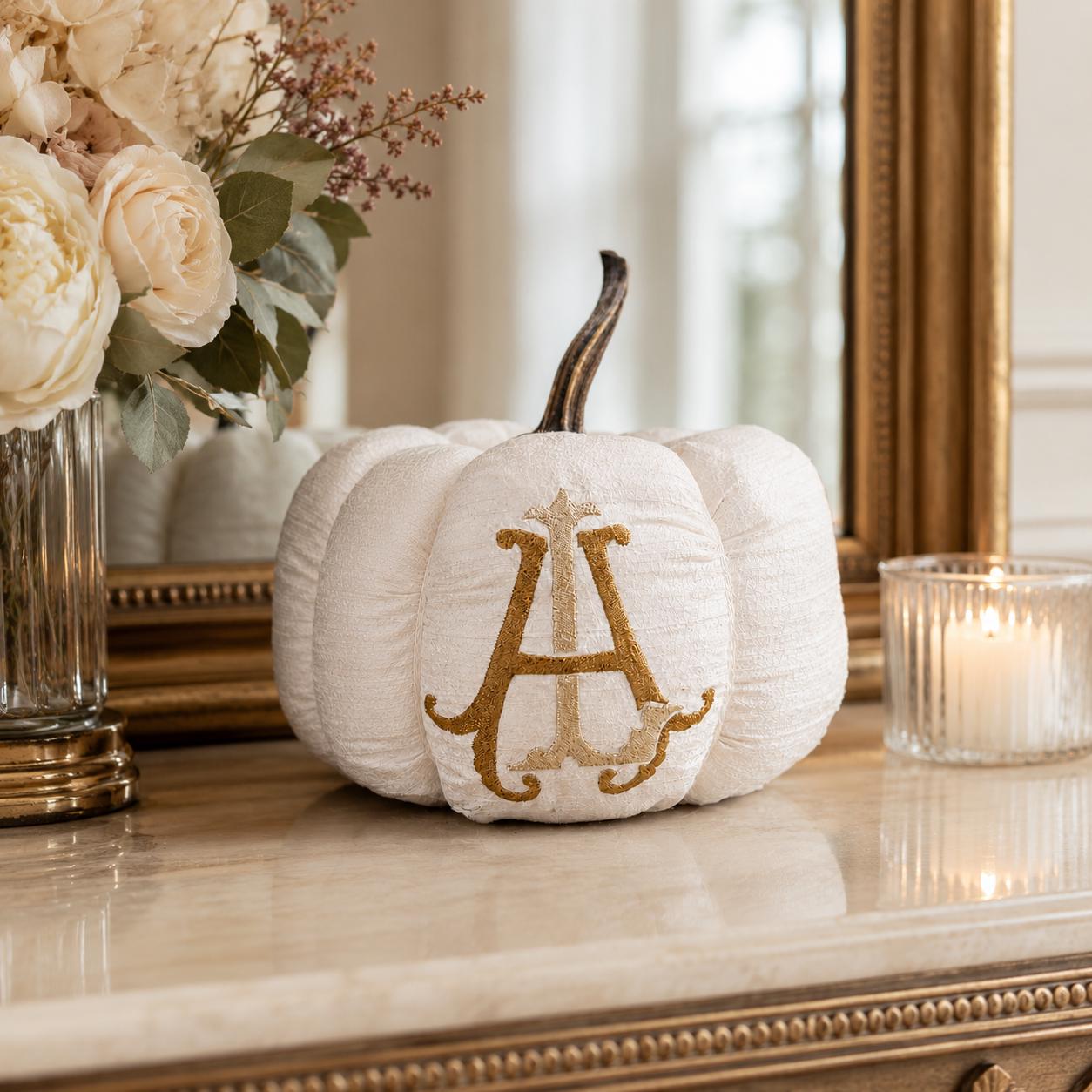 Monroe ivory silk monogram pumpkin in the Gilded palette styled on an entry table