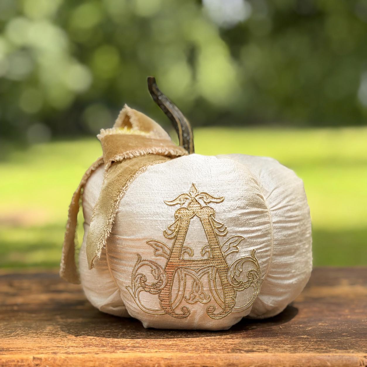 Chateau ivory silk pumpkin with gold velvet bow and Gilded monogram