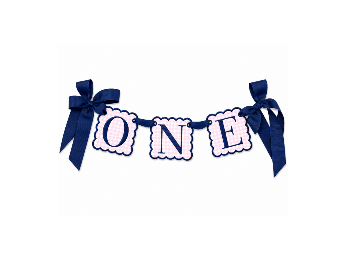 Pink gingham ONE high-chair banner with navy embroidery and grosgrain ribbon