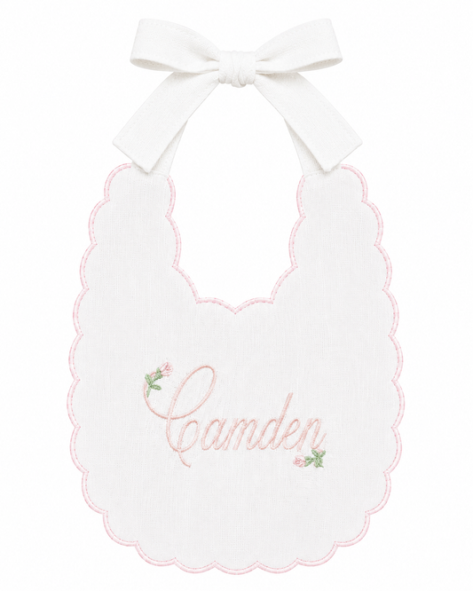 Rosebud personalized linen first birthday bib with embroidered name and delicate pink floral details