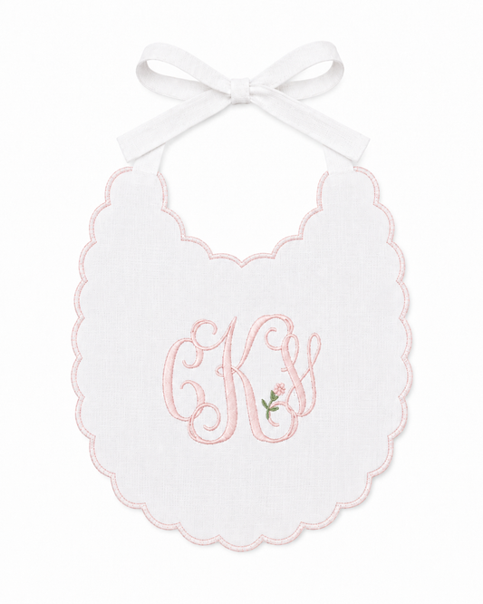 Rosebud triple monogram linen first birthday bib with delicate pink floral embroidery